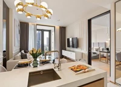 Modern open-plan living, dining, and kitchen area with elegant furnishings