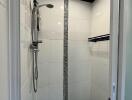 Modern bathroom shower area with tiled walls and overhead shower