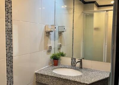 Modern bathroom with large mirror and sink