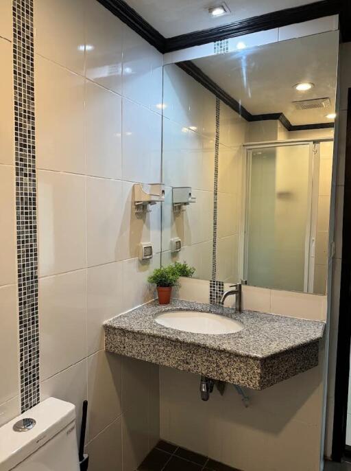 Modern bathroom with large mirror and sink