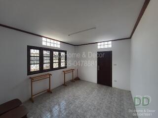 Simple room with windows and tiled floor