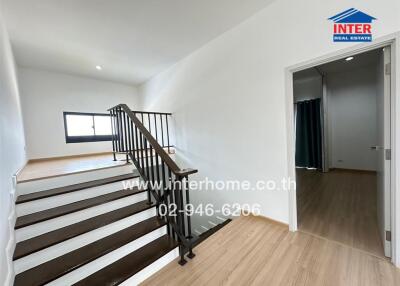 Modern house interior with staircase and wooden flooring