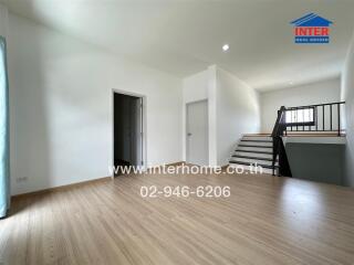 Spacious area with staircase and open space