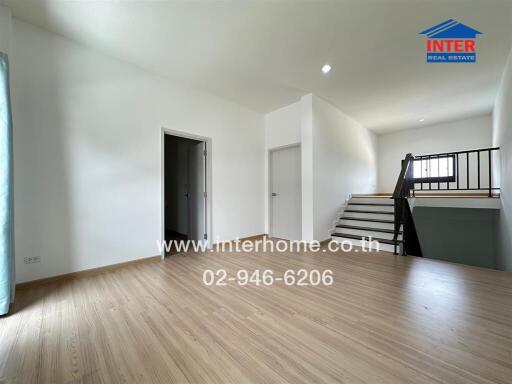 Spacious area with staircase and open space