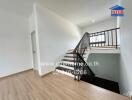 Staircase area with wooden flooring