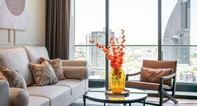 Modern living room with large window and city view