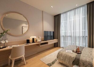 Spacious and modern bedroom with desk and large window