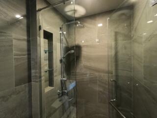 Modern shower area with glass doors