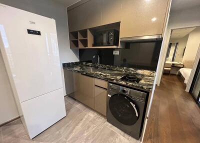 Modern kitchen with appliances and marble countertop