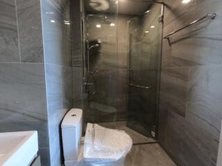 Modern bathroom with glass shower and toilet