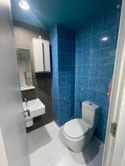 Modern bathroom with blue tiles