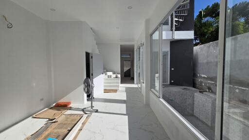 spacious living area with large windows