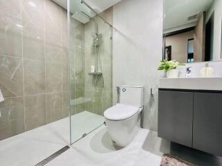 Modern bathroom with glass shower enclosure and vanity