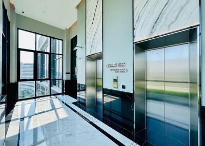 Bright and modern building entrance with elevators