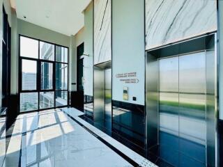 Bright and modern building entrance with elevators