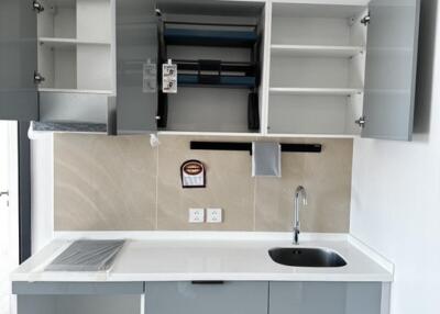 modern kitchen with open cabinets and drawers