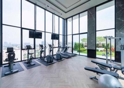 Modern gym with city view and exercise equipment