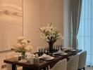 Elegant dining room with a set dining table and large painting