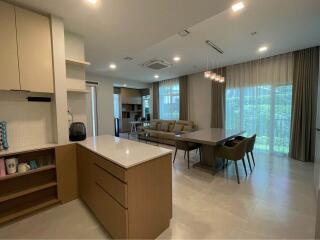 Modern open-concept living area with kitchen and dining space