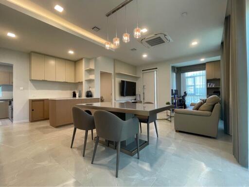 Modern open-concept living and dining room with kitchen