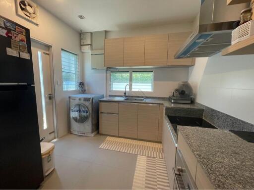 Modern kitchen with appliances and natural lighting