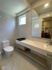 Modern bathroom with large mirror and elegant countertop