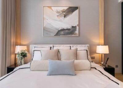 Modern bedroom with artwork and soft lighting