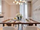 Elegant dining area with a set table and modern chandelier