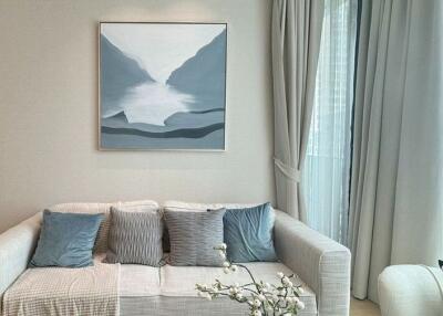 Modern living room with a sofa and artwork on the wall