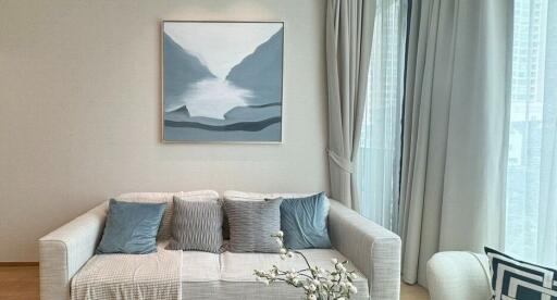 Modern living room with a sofa and artwork on the wall