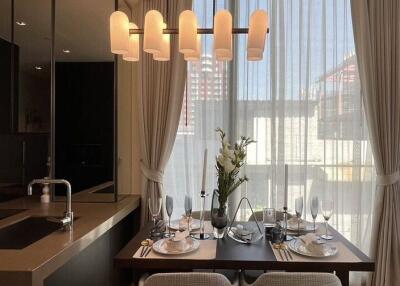 Modern dining area with elegant lighting and table setting
