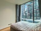 Bedroom with large window and modern decor