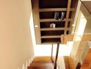Modern wooden staircase with glass railing