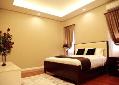 Spacious and elegantly decorated bedroom with modern furnishings
