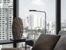 Modern living room with large windows and a view of the city skyline