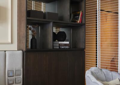 Modern living room with a bookshelf and seating area