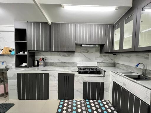 Modern kitchen with black and white cabinetry