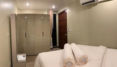 Modern bedroom with wardrobe and air conditioning