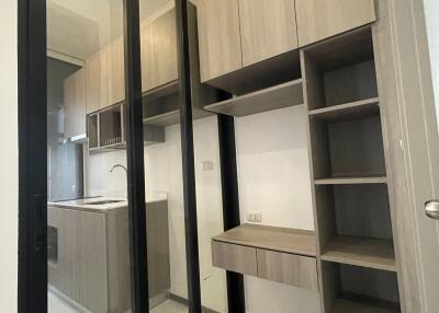 Compact modern kitchen with wooden cabinets and ample storage space