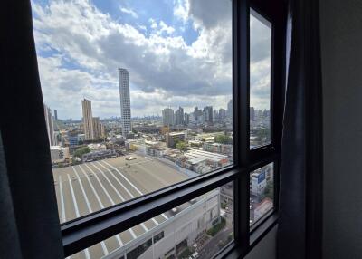 View of cityscape from window in high-rise building