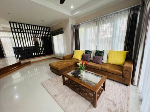 Spacious living room with sectional sofa and coffee table