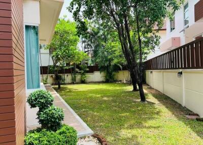 Backyard with garden and paved walkway