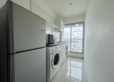 Modern kitchen with appliances and city view