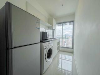 Modern kitchen with appliances and city view