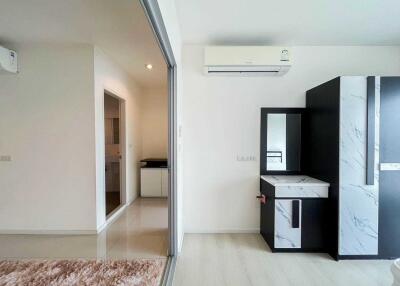 Modern bedroom with air conditioning and wardrobe