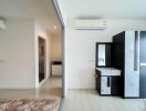 Modern bedroom with air conditioning and wardrobe