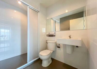 Modern bathroom with shower and wall-mounted sink