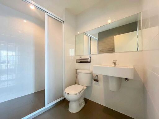 Modern bathroom with shower and wall-mounted sink