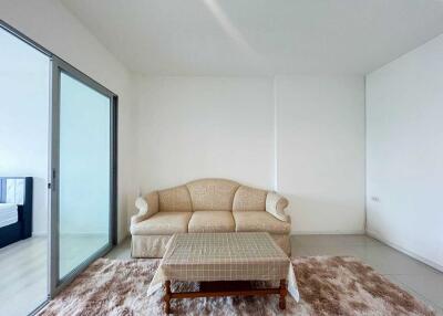 Living room with a beige sofa and coffee table