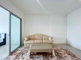 Living room with a beige sofa and coffee table